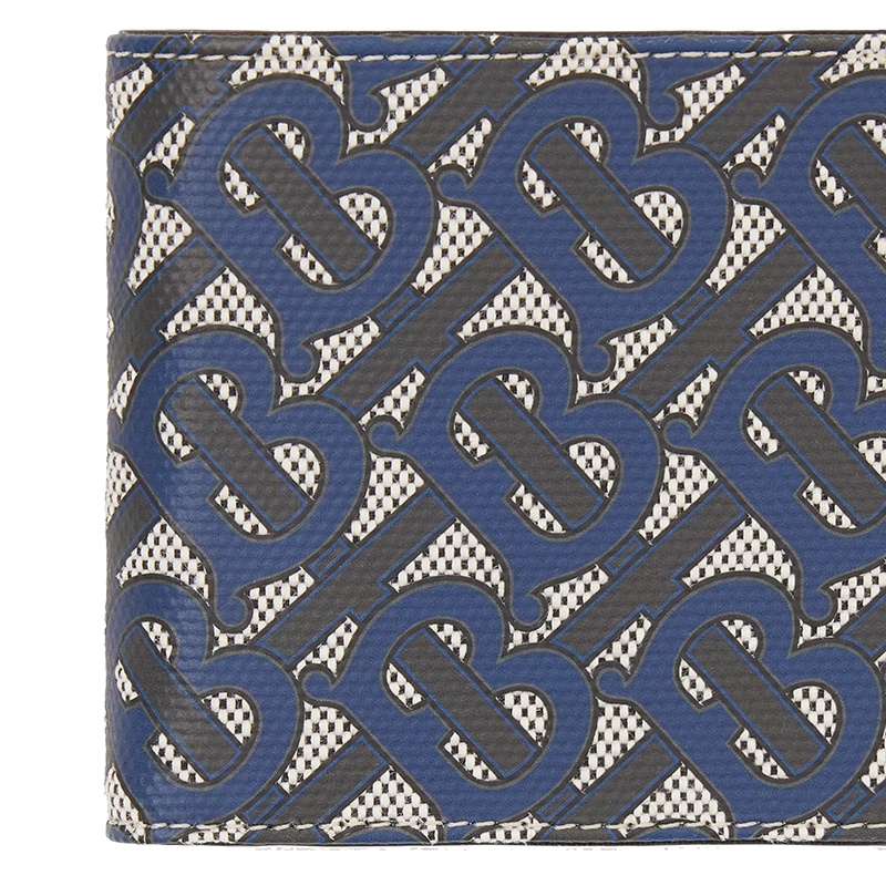 这款翻盖钱包由棉帆布制成,饰有我们的monogram图案.